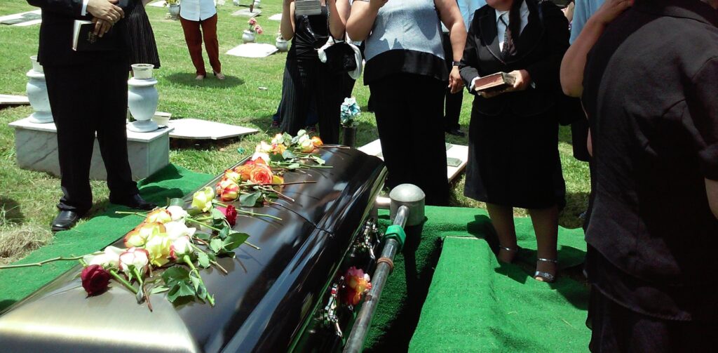 Group of people attending burial