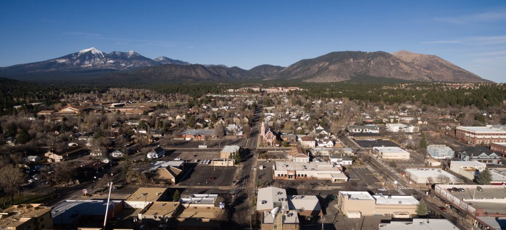 Aerial view of Flagstaff, Arizona, looking north toward Humphreys Peak, on a page about northern Arizona asbestos exposure sites